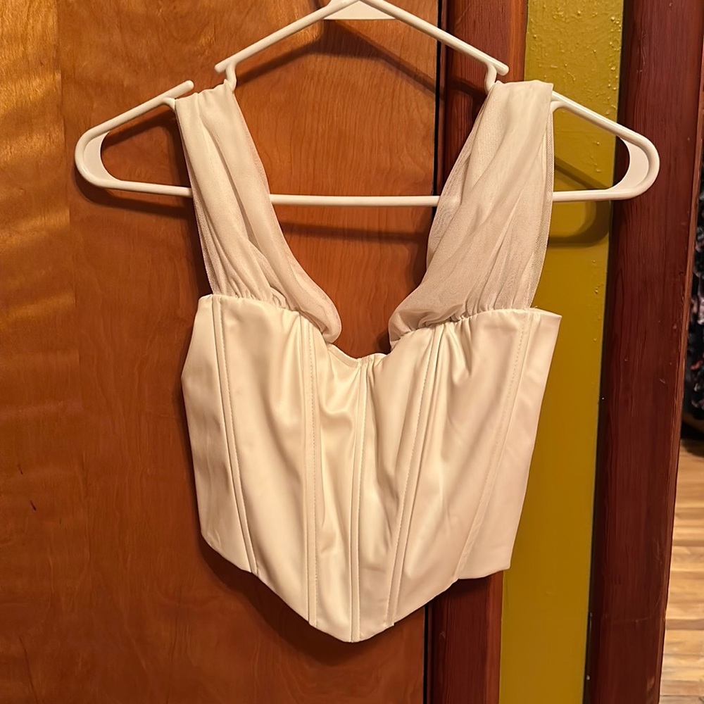 A white off the shoulder corset top
